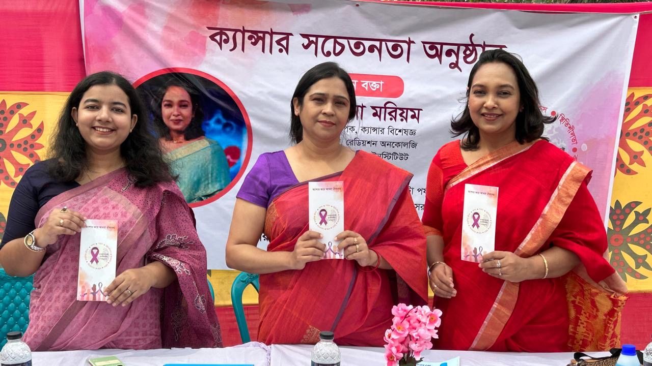 Three CCI Foundation members holding cancer awareness leaflets at the Norail program