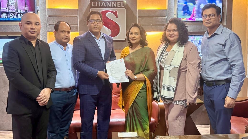 CCI Foundation and Channel S representatives holding the signed memorandum of understanding in the Channel S studio